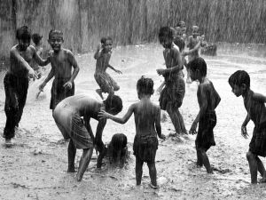children-play-rain-india_18731_990x742